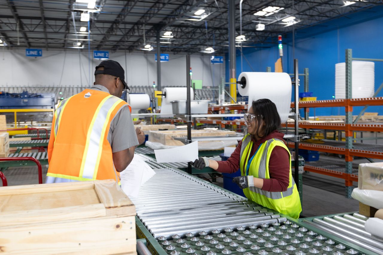 Employees working in manufacturing warehouse