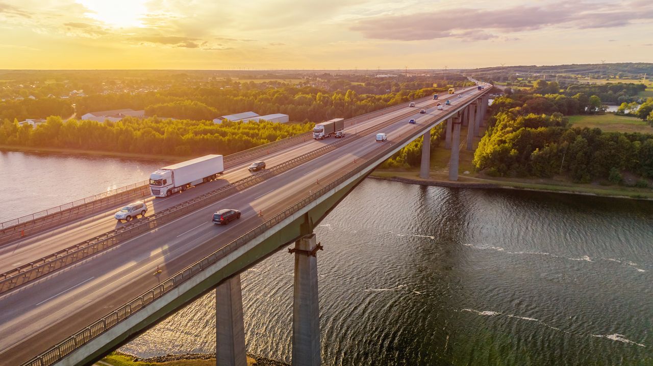 Cars and Truck crossing over a bridge